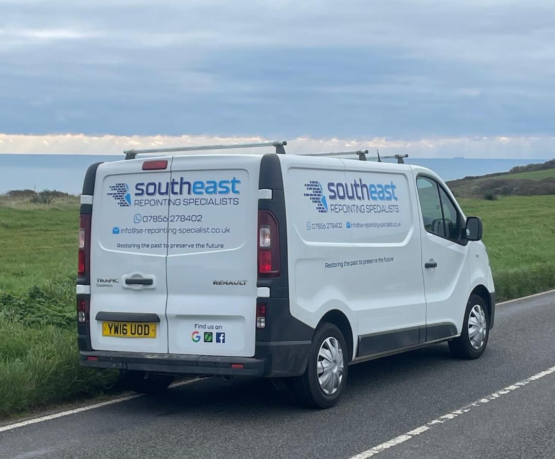 The rear of our liveried van with our phone number and email